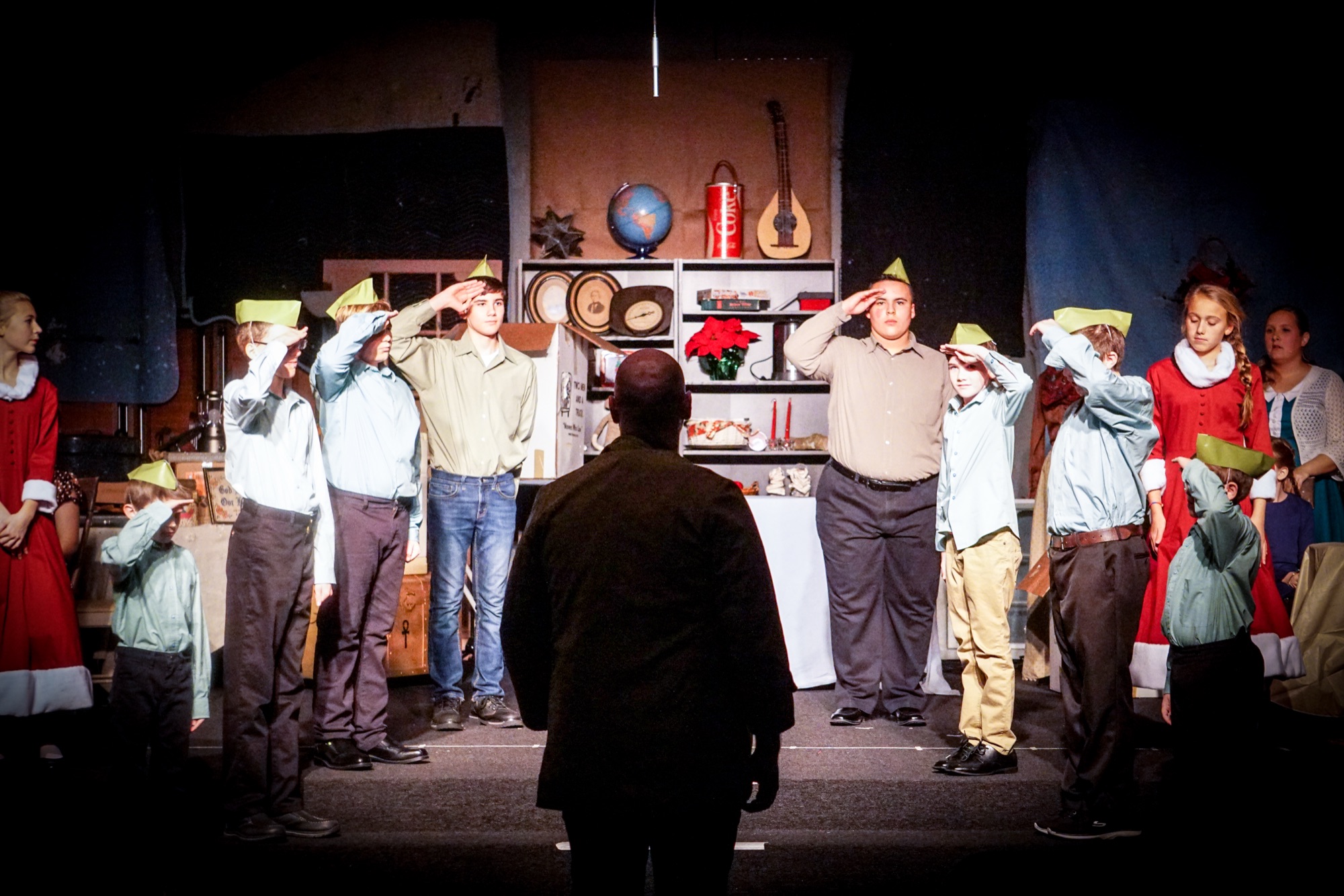 The cast mid-scene during a full production